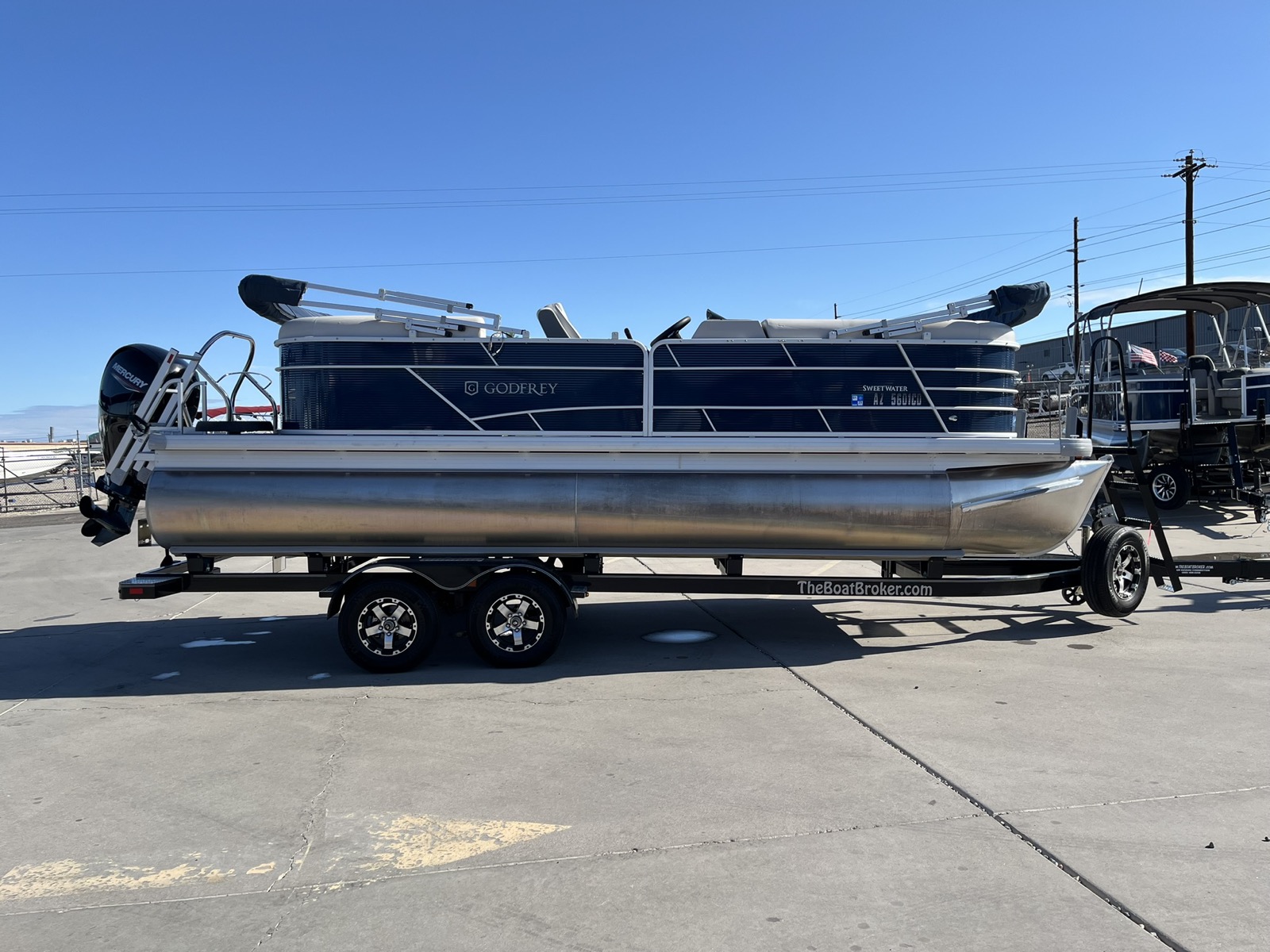 Pontoon boats on the lot at The Boat Brokers